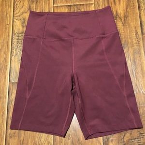 Girlfriend collective bike shorts in mulberry